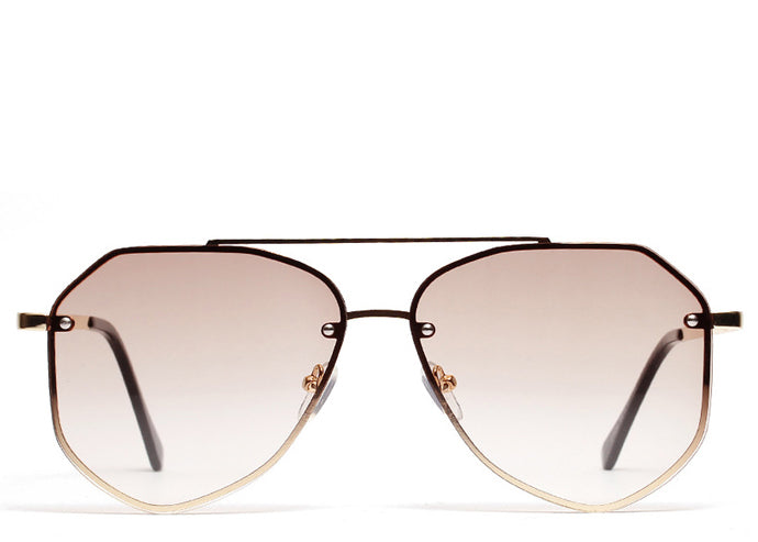 Women's brown tinted oversized aviator sunglasses with gold frame