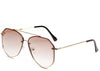 Women's brown tinted oversized aviator sunglasses with gold frame