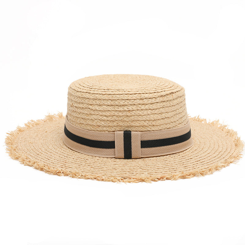 Women's boater straw hat with frayed edging and black ribbon detail