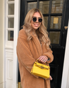 Women's yellow vegan faux leather mini handbag with gold hardware