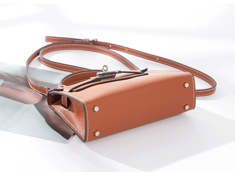 Women's tan vegan faux leather mini handbag with silver hardware